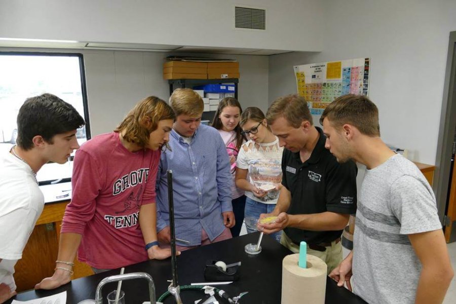 Grove, OK: Student inoculate Petri dishes with slime mold during CaveSim biology lab