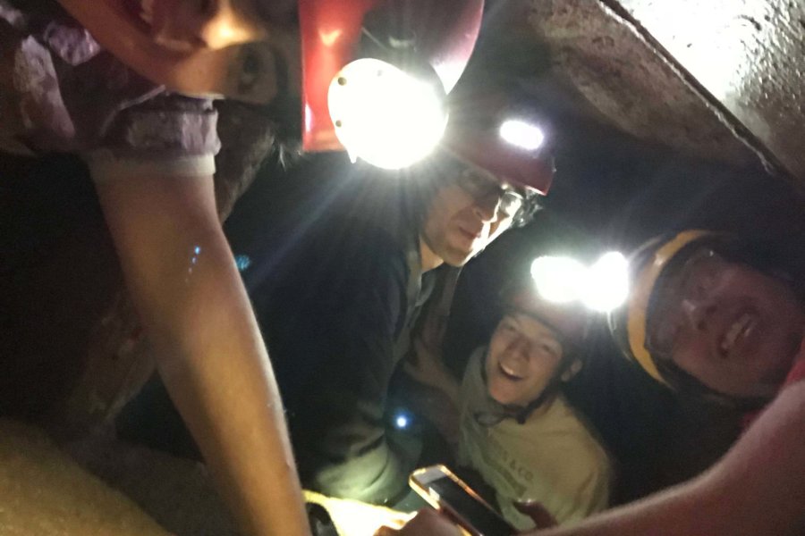 Austin, TX: A group of students explores the cave