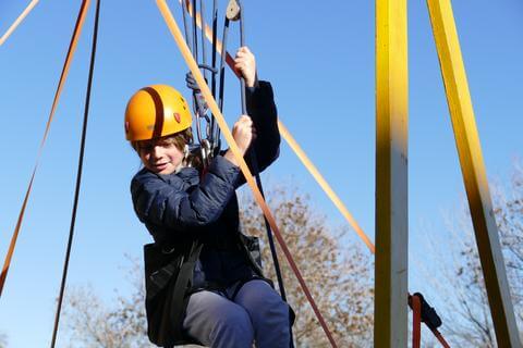 Denver, CO: A participant uses pulleys to lift himself up the CaveSim tower at the Denver Museum of Nature and Science